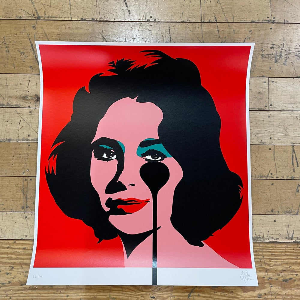 A portrait of Liz Taylor in a contemporary style, featuring black paint dripping from her eye onto a red background. The image showcases an artistic representation of Liz Taylor, highlighting her beauty and individuality.