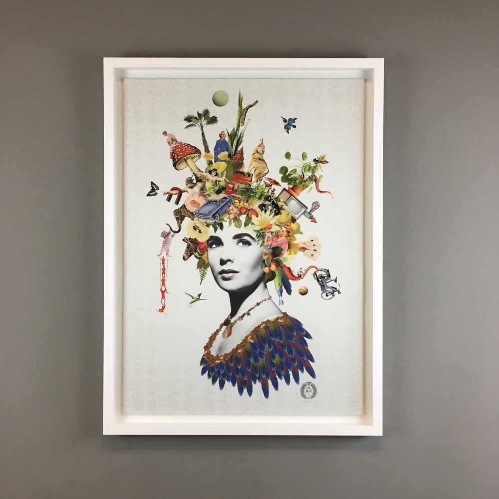 Grey/white portrait of a woman with colorful surreal objects emerging from her head on a white background, placed in a white frame