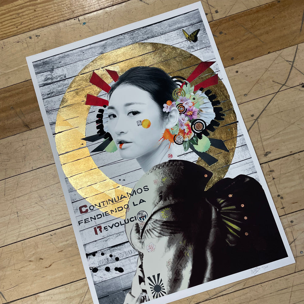 Gold leaf circle painting around an Asian woman with white face paint, looking to the side, on a grey and white wooden background