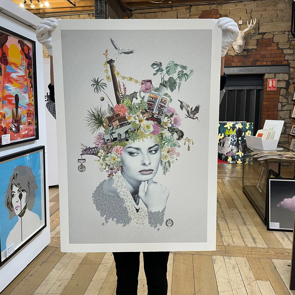 Colorful objects on the head of a frowning woman on a white/grey background