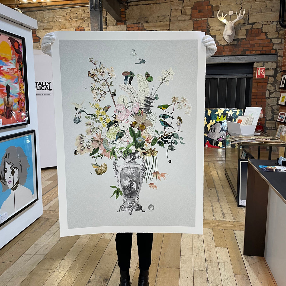 Maria Rivans Projects Grey vase filled with a variety of colorful flowers and objects